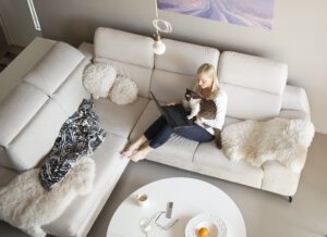 Mature woman and cute cat talking through video chat with her children who are in isolation during the coron virus covid-19 pandemic